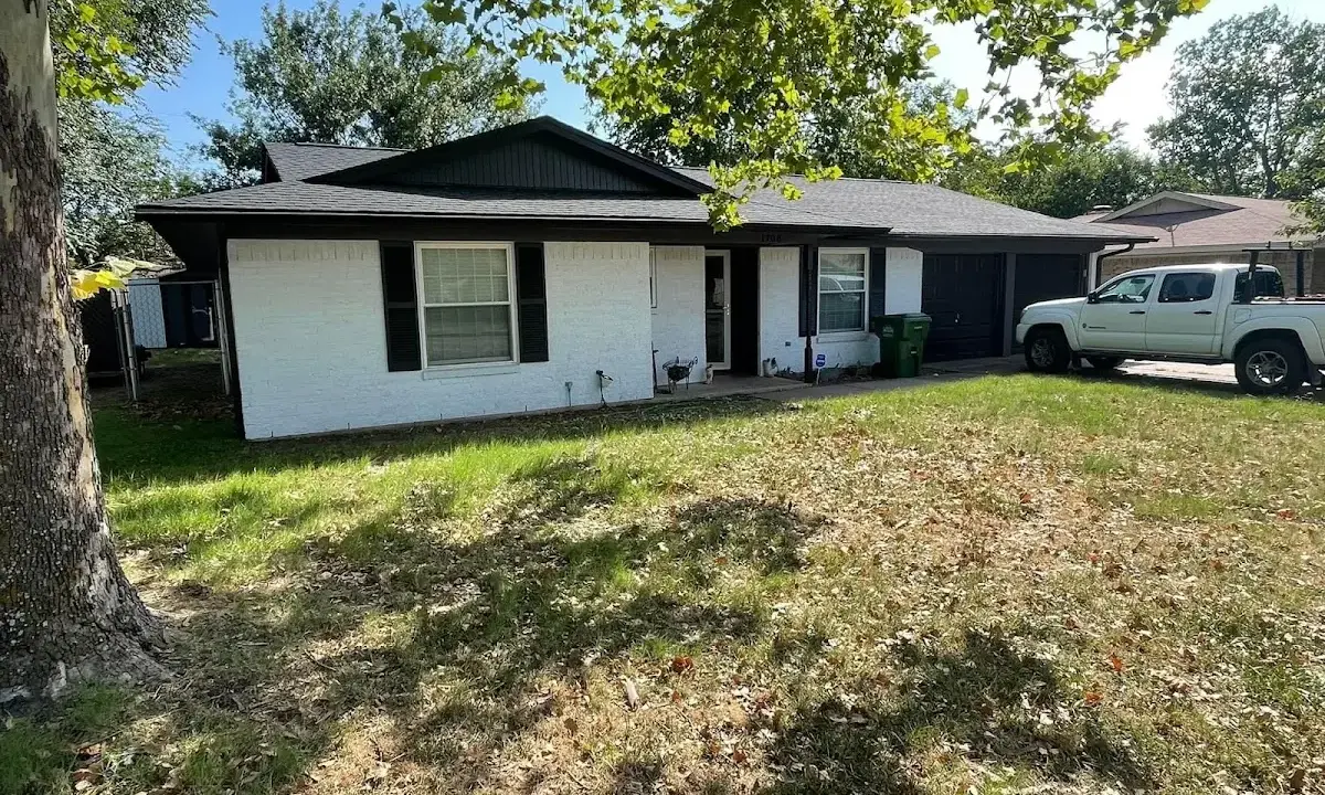 Professional roofing crew working on a residential roof in Arcadia
